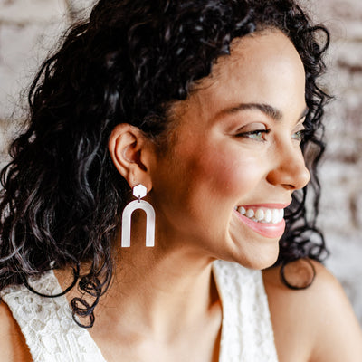 Brushed Silver u-shaped post Back earrings on model.