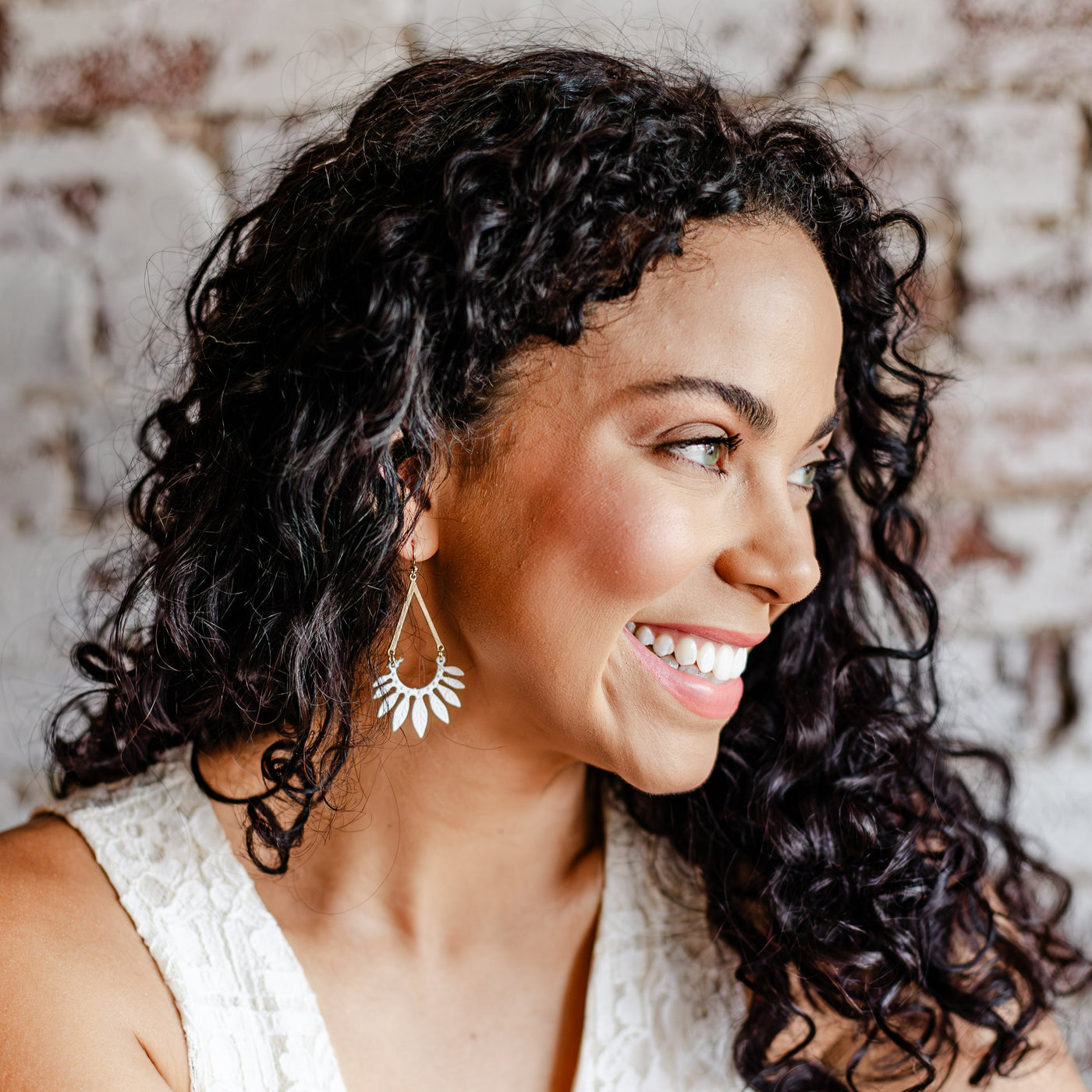 Model wearing the Matte White Leaf Dangle Earrings