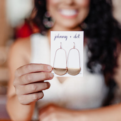 THE SOPHIE HALF MOON BRUSHED EARRINGS IN GOLD featured on an earring card. 