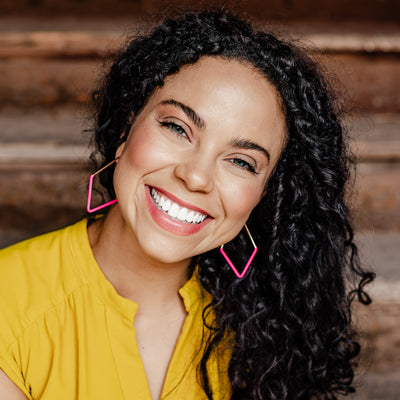 Gold Rosalie Geometric Hoops with Bright Pink Matte Coating on model. 