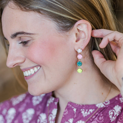 Model wearing Multi-Colored Happy Face Dangle Earrings