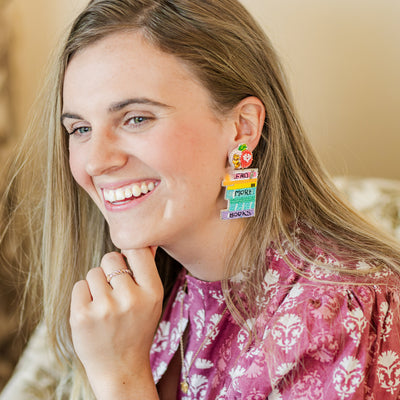 Model wearing Beaded Read More Books teacher earrings.